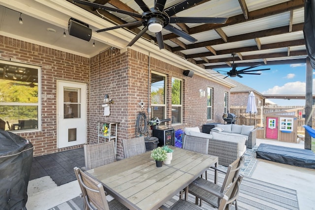 view of patio / terrace with grilling area, ceiling fan, and an outdoor hangout area