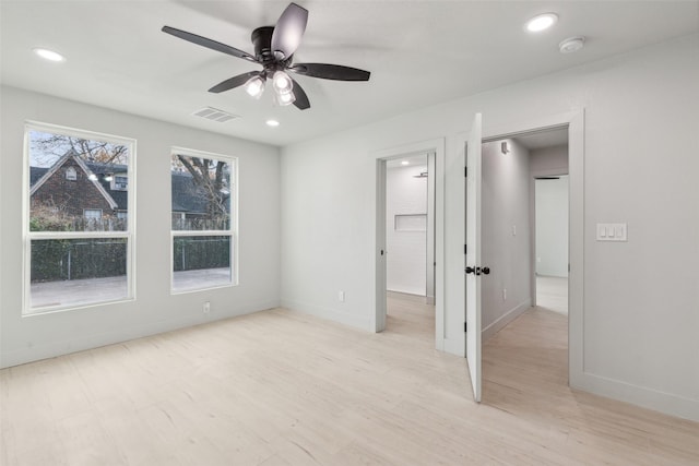 unfurnished bedroom featuring ceiling fan and light hardwood / wood-style flooring