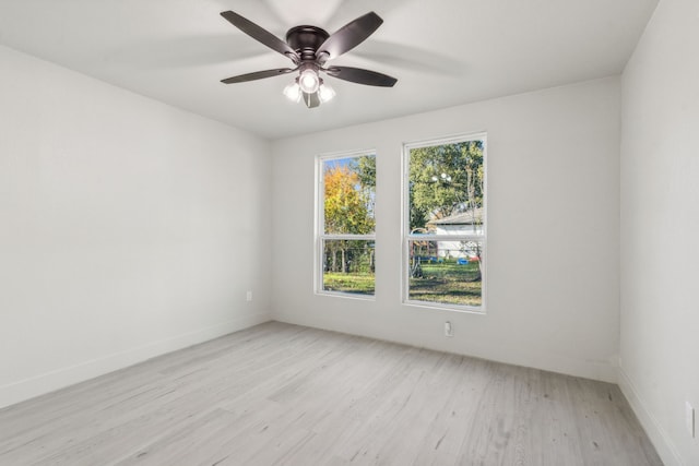 spare room featuring ceiling fan and light hardwood / wood-style floors