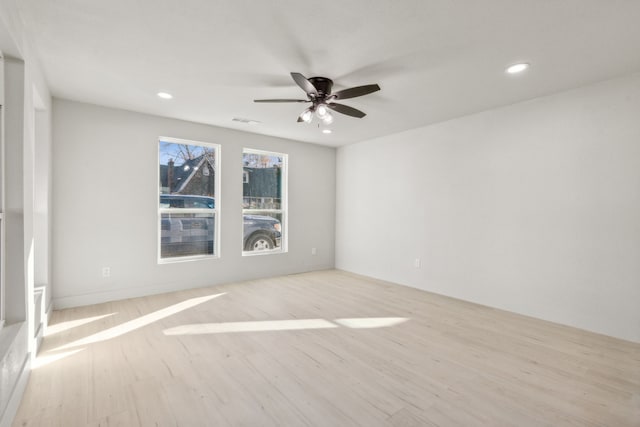 empty room featuring light hardwood / wood-style flooring and ceiling fan