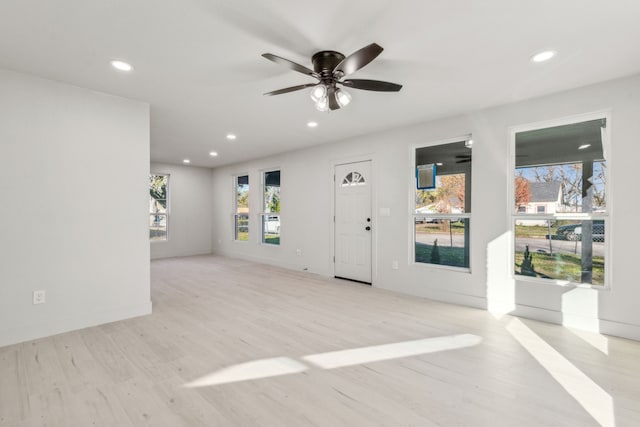 interior space with ceiling fan and light wood-type flooring