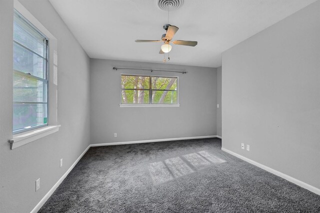 empty room featuring carpet and ceiling fan