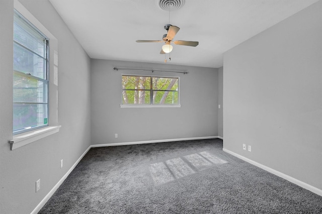 empty room featuring carpet floors and ceiling fan