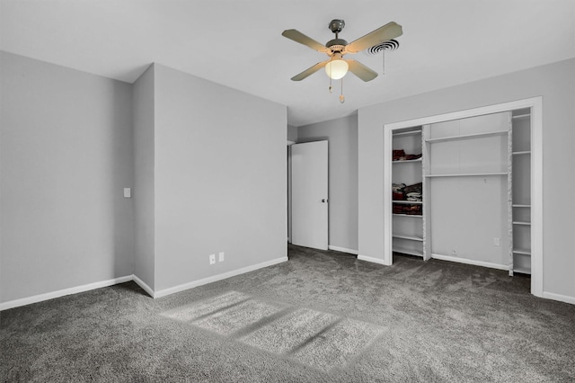 unfurnished bedroom with ceiling fan and dark carpet