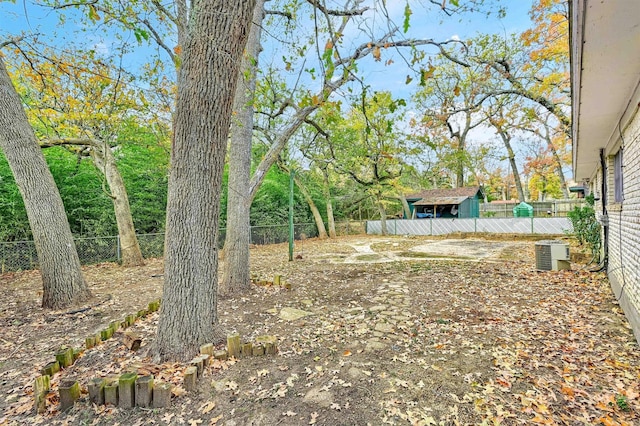 view of yard with central AC