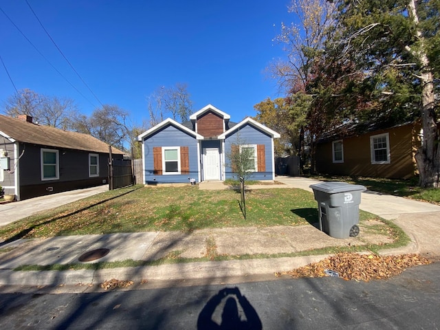 view of front of home with a front lawn