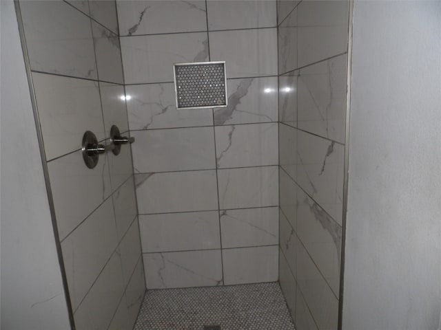 bathroom with tiled shower