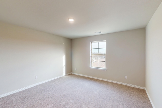 5000 Greenbrook Rd, Denton, TX 76226 - unfurnished room with light colored carpet, baseboards, and recessed lighting