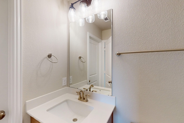 5000 Greenbrook Rd, Denton, TX 76226 - bathroom featuring vanity and a textured wall