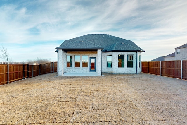 5000 Greenbrook Rd, Denton, TX 76226 - rear view of property featuring a fenced backyard, roof with shingles, and a patio