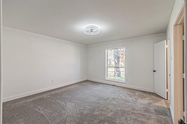 empty room with carpet flooring