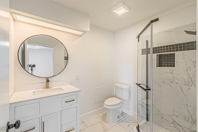 bathroom featuring vanity, toilet, and a shower with shower door