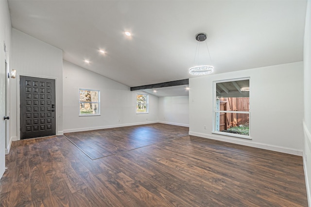 unfurnished living room with dark hardwood / wood-style flooring and lofted ceiling