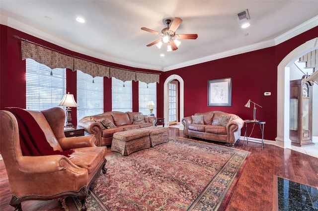 living room featuring ceiling fan, crown molding, a healthy amount of sunlight, and hardwood / wood-style flooring