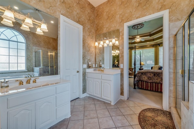 bathroom featuring walk in shower, ceiling fan, vanity, and tile patterned flooring