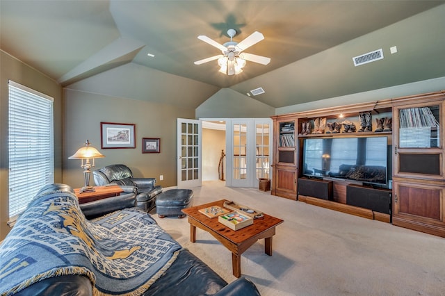 living room with vaulted ceiling, carpet flooring, ceiling fan, and french doors