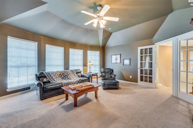 carpeted living room featuring french doors, ceiling fan, and lofted ceiling