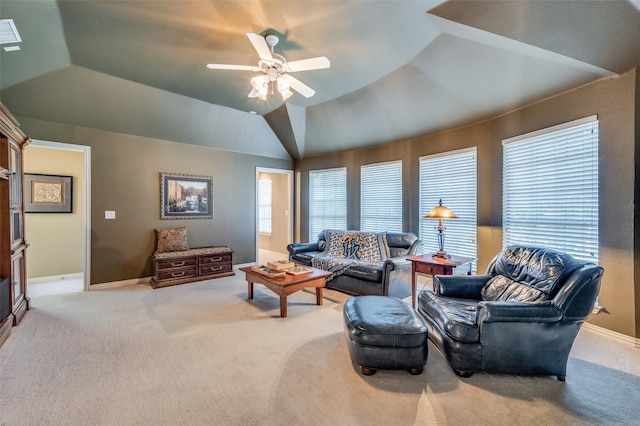 carpeted living room featuring vaulted ceiling and ceiling fan