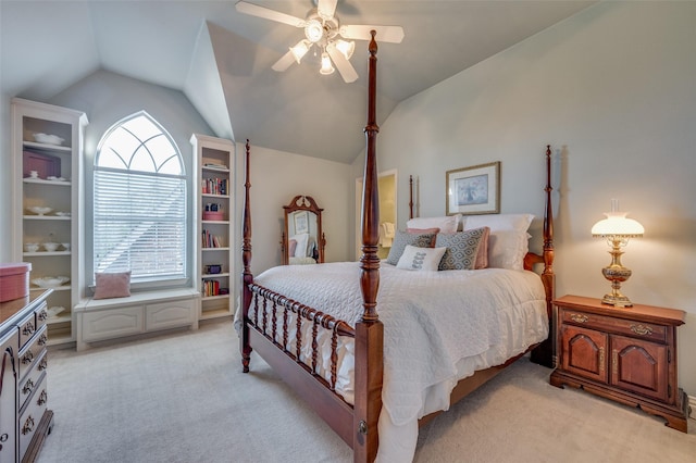 bedroom featuring lofted ceiling, light colored carpet, and ceiling fan