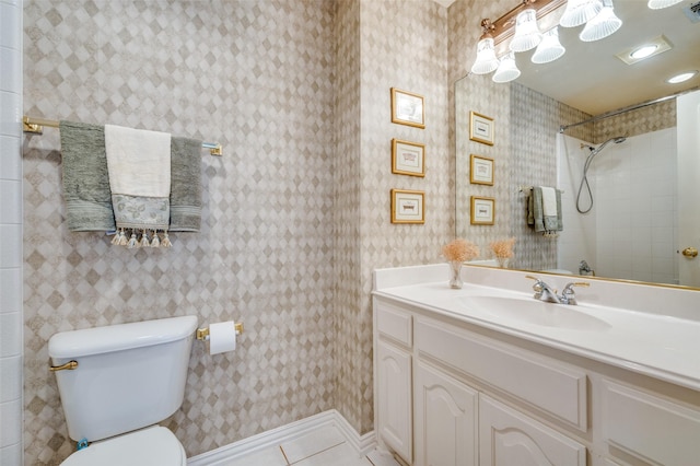 bathroom featuring tile patterned flooring, vanity, and toilet