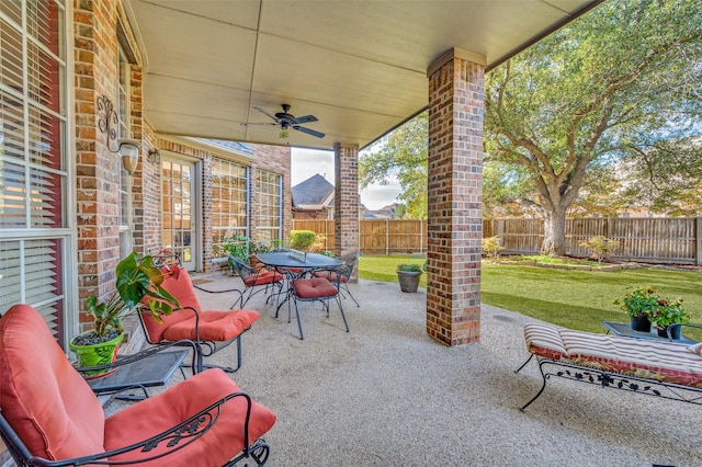 view of patio featuring ceiling fan