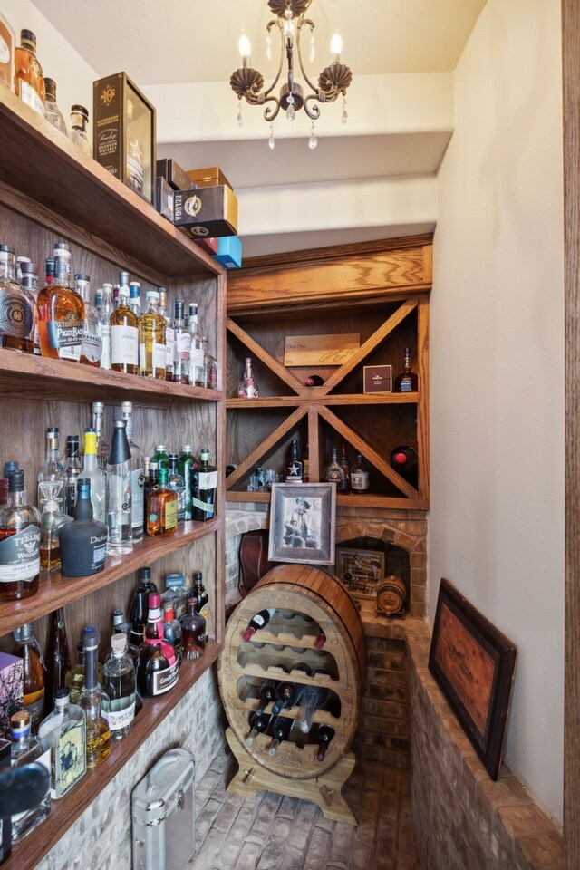 wine area with an inviting chandelier