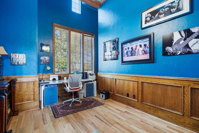 office area with light hardwood / wood-style floors