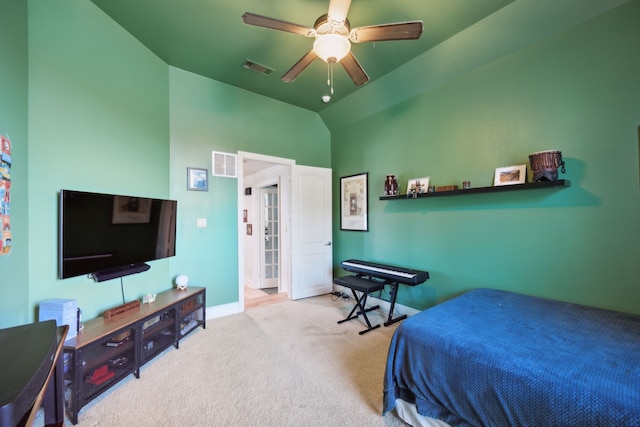 carpeted bedroom featuring ceiling fan and vaulted ceiling