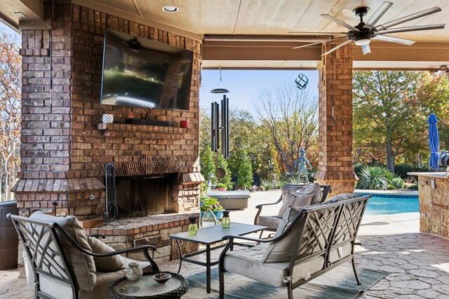 view of patio featuring a sunroom and ceiling fan