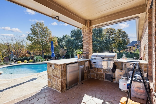 view of patio / terrace with a grill and exterior kitchen