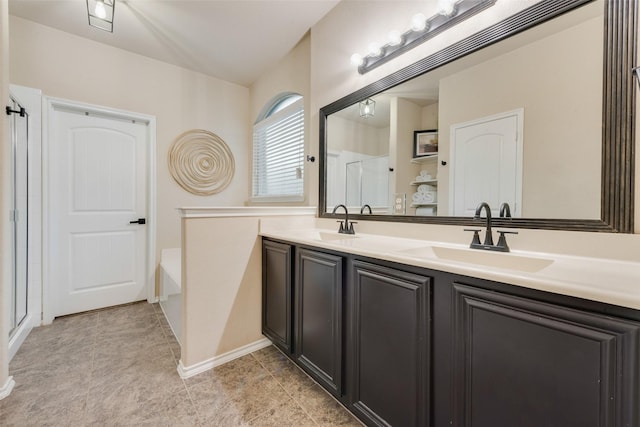 bathroom with tile patterned flooring, shower with separate bathtub, and vanity