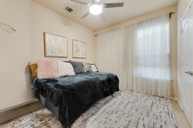 bedroom featuring ceiling fan and light colored carpet