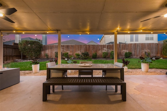 patio terrace at dusk with ceiling fan