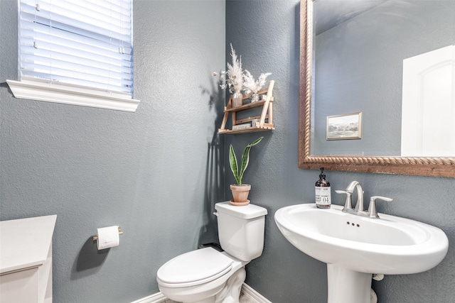 bathroom featuring sink and toilet