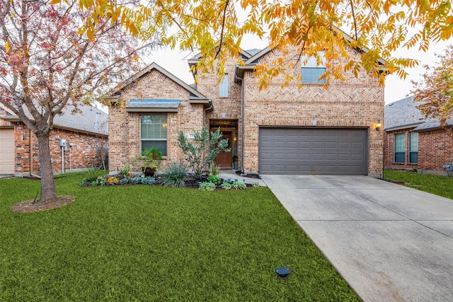 traditional-style house with brick siding, a garage, a front yard, and driveway