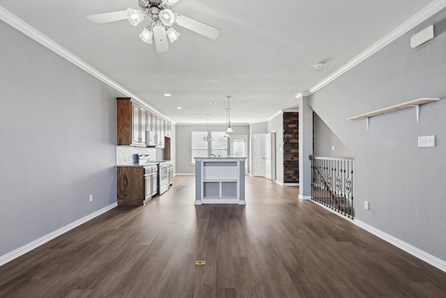 unfurnished living room featuring crown molding, ceiling fan, and dark hardwood / wood-style flooring