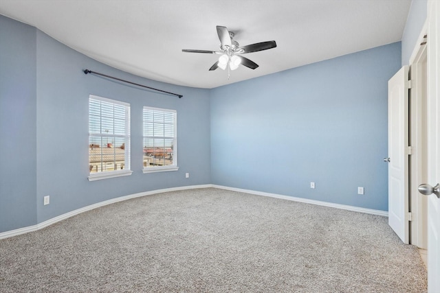 carpeted empty room with ceiling fan