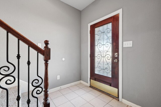 entrance foyer featuring light tile patterned floors