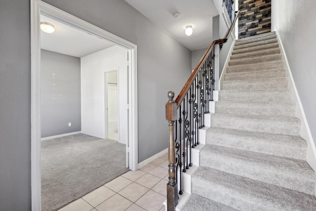 stairs featuring carpet