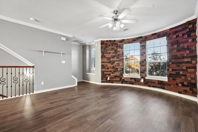 unfurnished living room featuring ceiling fan, ornamental molding, and hardwood / wood-style floors