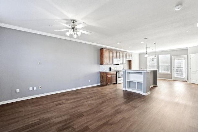 kitchen with hanging light fixtures, stainless steel electric range oven, a kitchen island, and dark hardwood / wood-style flooring