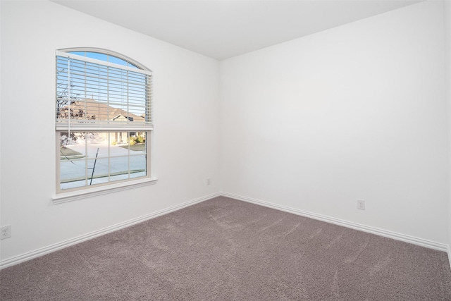 unfurnished room with carpet floors