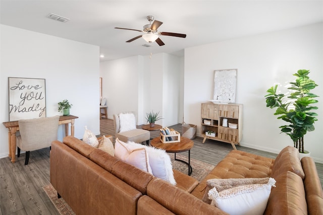 living room with hardwood / wood-style floors and ceiling fan