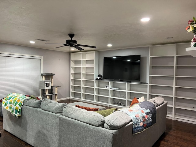 living room featuring dark hardwood / wood-style flooring and ceiling fan