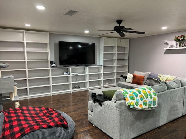 living room with dark hardwood / wood-style flooring and ceiling fan