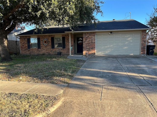 single story home with a garage and a front yard