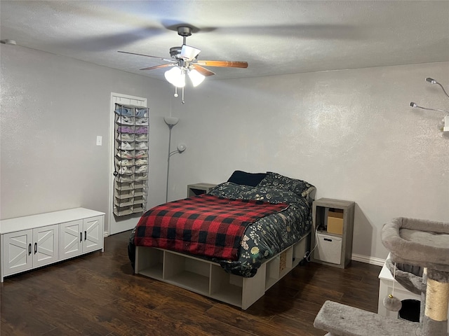 bedroom featuring ceiling fan and dark wood-type flooring