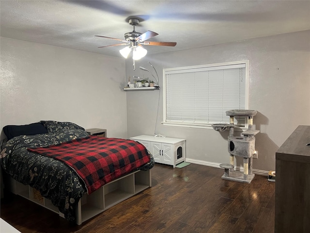 bedroom featuring ceiling fan and dark hardwood / wood-style flooring