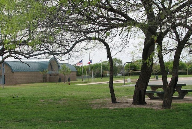 view of community featuring a lawn