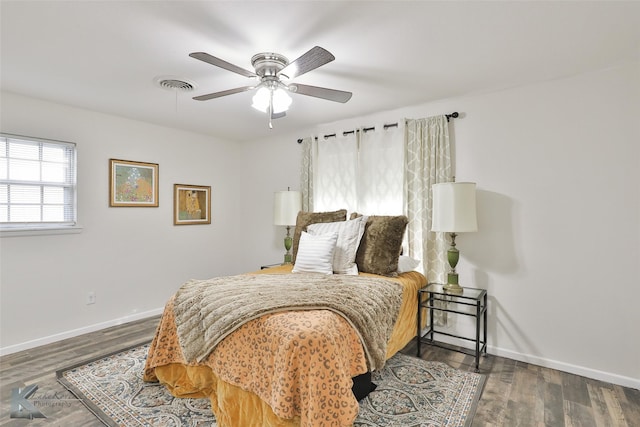 bedroom featuring ceiling fan and dark wood-type flooring